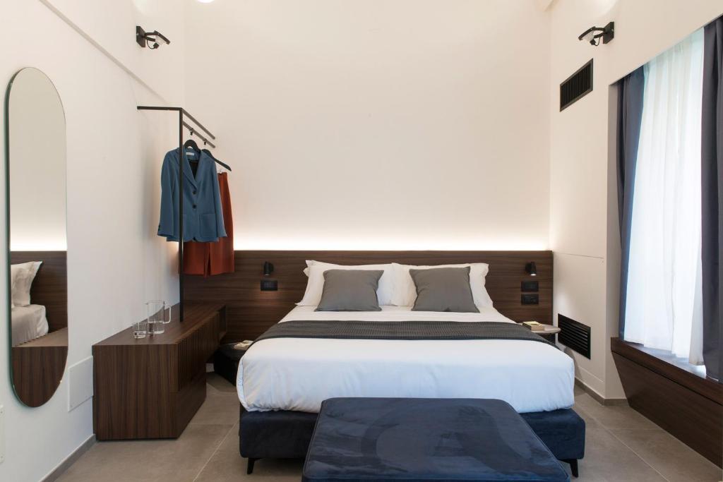 Postel nebo postele na pokoji v ubytování Spazio Gagarin Residence