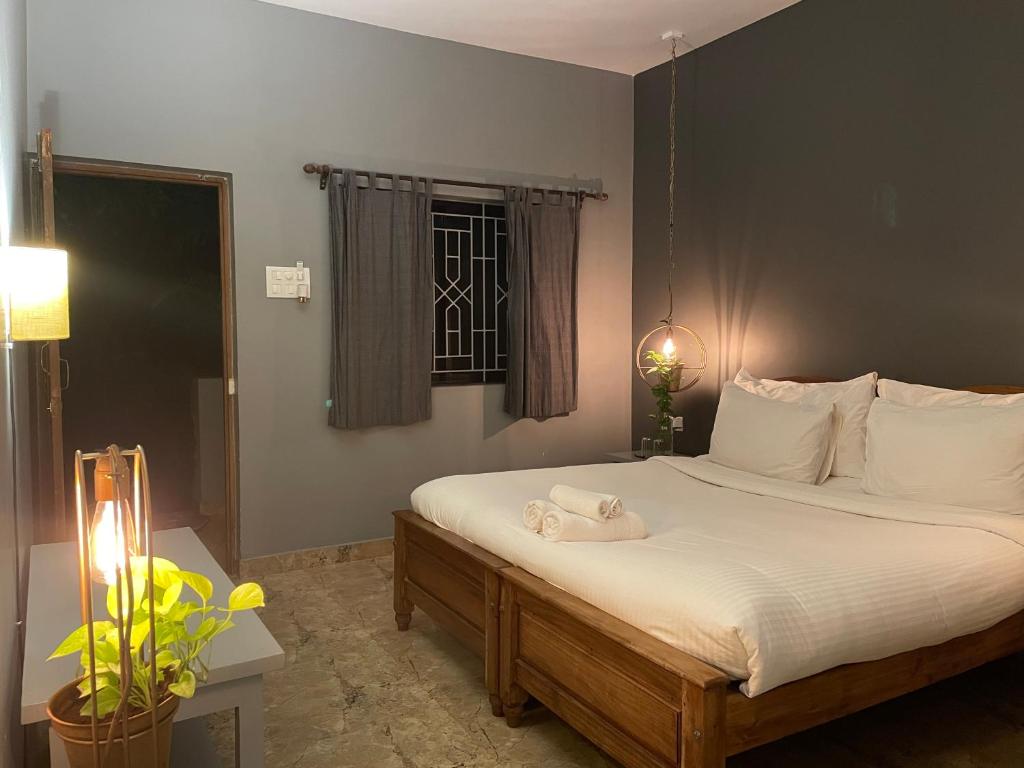 Postel nebo postele na pokoji v ubytování Tien B&B & Bistro