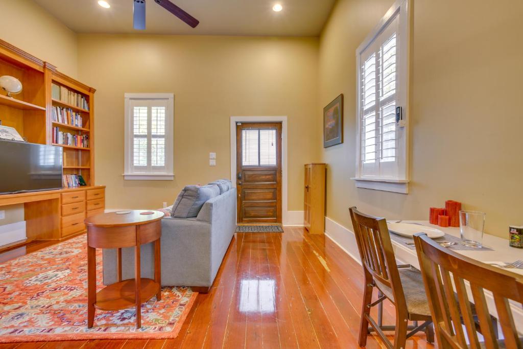 a living room with a couch and a table at Cozy New Orleans Getaway Near Magazine Street! in New Orleans