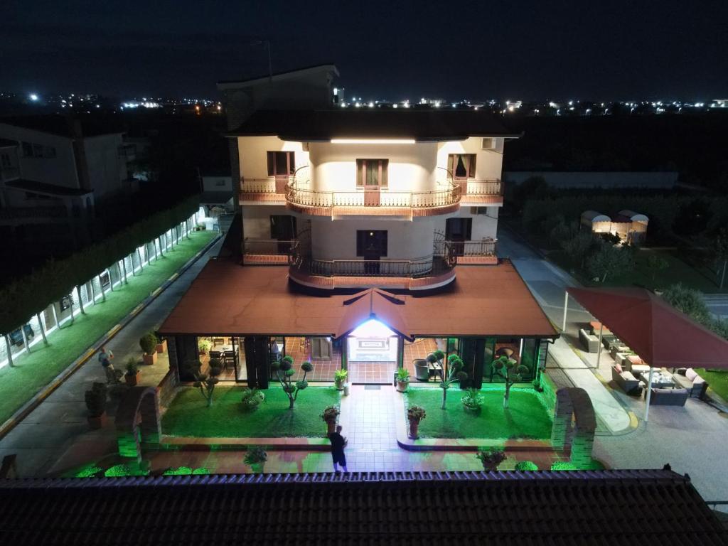 an aerial view of a building at night at Drini Hotel in Durrës