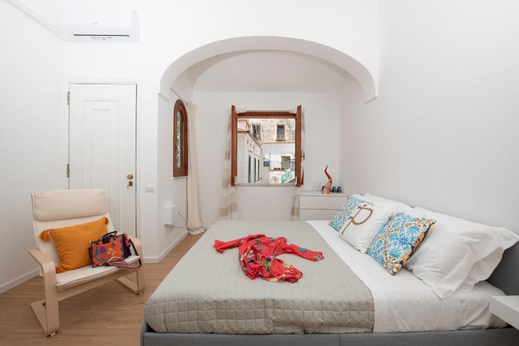 a bedroom with a bed with a red animal on it at Le Antiche Repubbliche Marinare in Amalfi