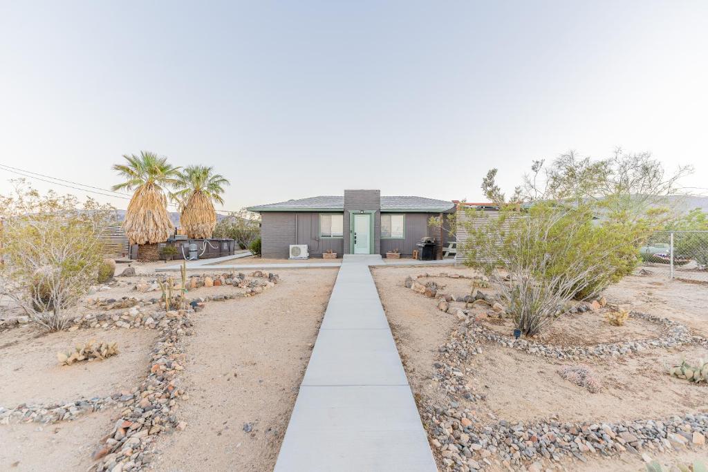a walkway in front of a house at NEW PROPERTY! The Cactus Villas at Joshua Tree National Park - Pool, Hot Tub, Outdoor Shower, Fire Pit in Twentynine Palms