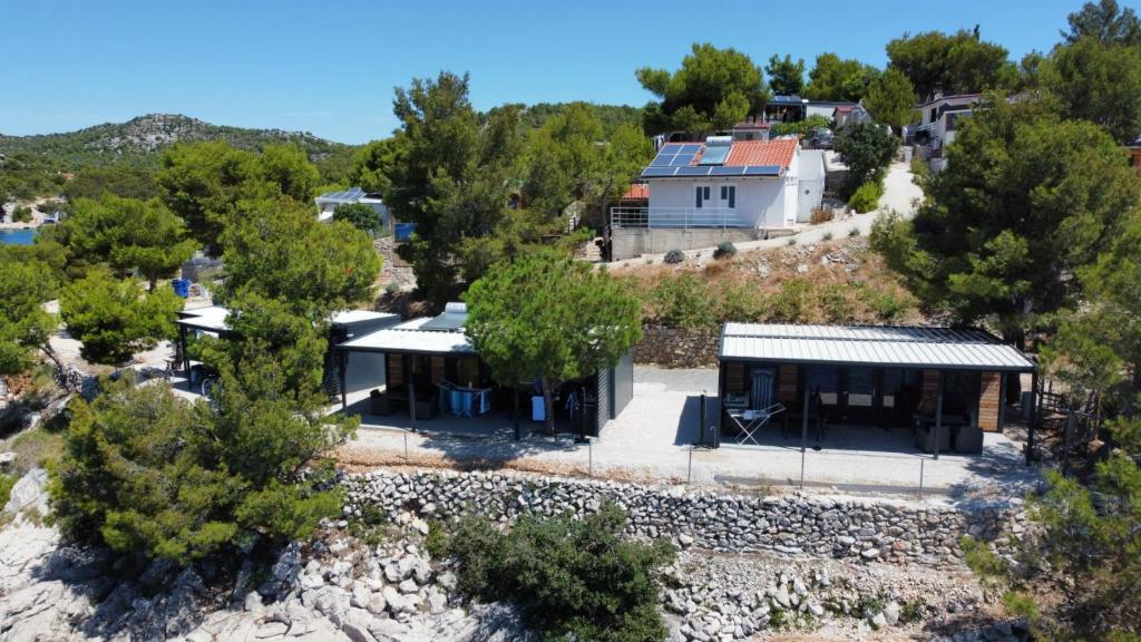an aerial view of a house with trees at Hipo camp Mobil home Arta in Pakoštane