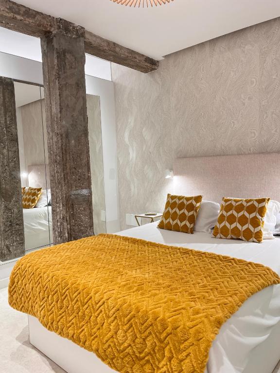 Postel nebo postele na pokoji v ubytování APARTAMENTOS PLAZA DEL CHARCO I