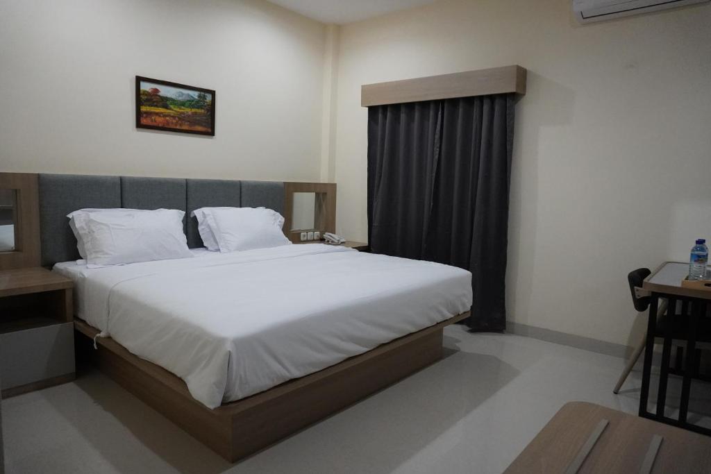 Postel nebo postele na pokoji v ubytování Hotel Luansa Klui