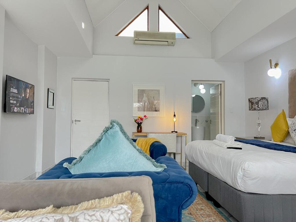 Rúm í herbergi á Amoris Guesthouse - In Randburg