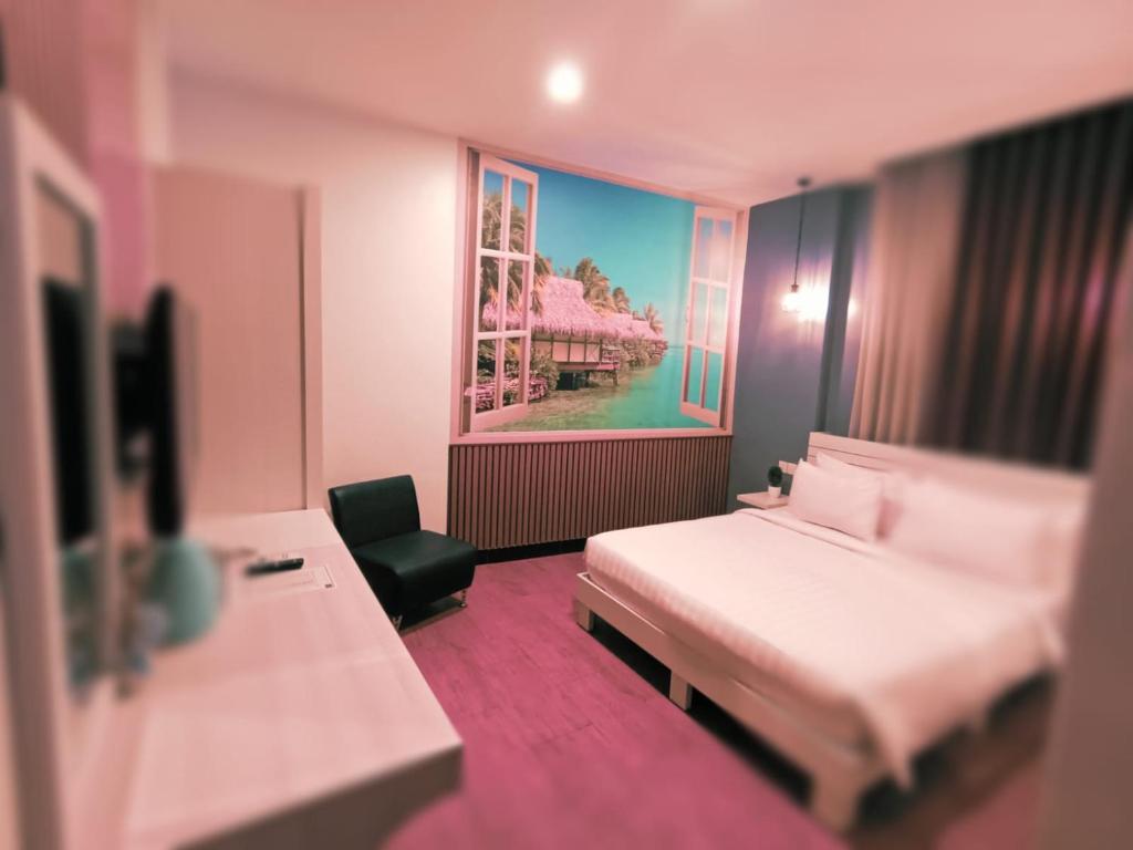 Postel nebo postele na pokoji v ubytování DE Hotel