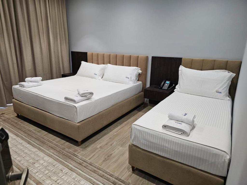 Postel nebo postele na pokoji v ubytování KAAN Hotel