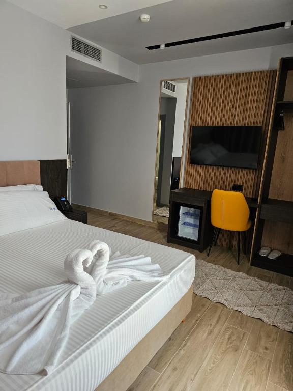 Postel nebo postele na pokoji v ubytování KAAN Hotel