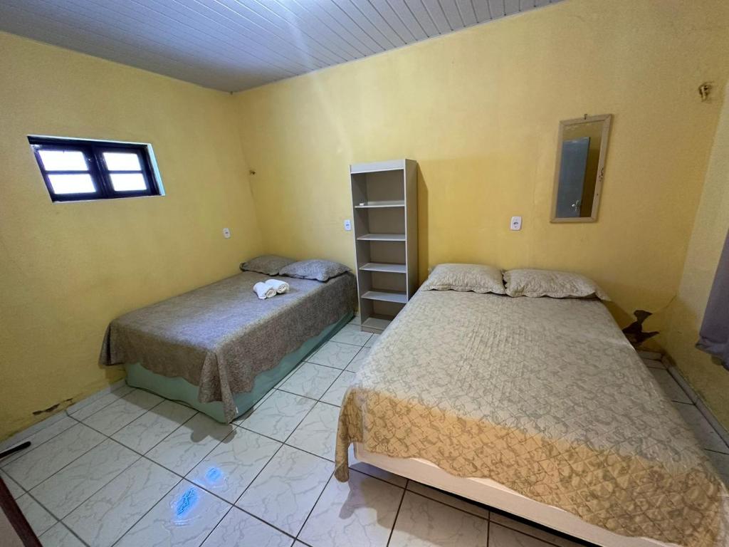Ένα ή περισσότερα κρεβάτια σε δωμάτιο στο Casa da Tia Avó