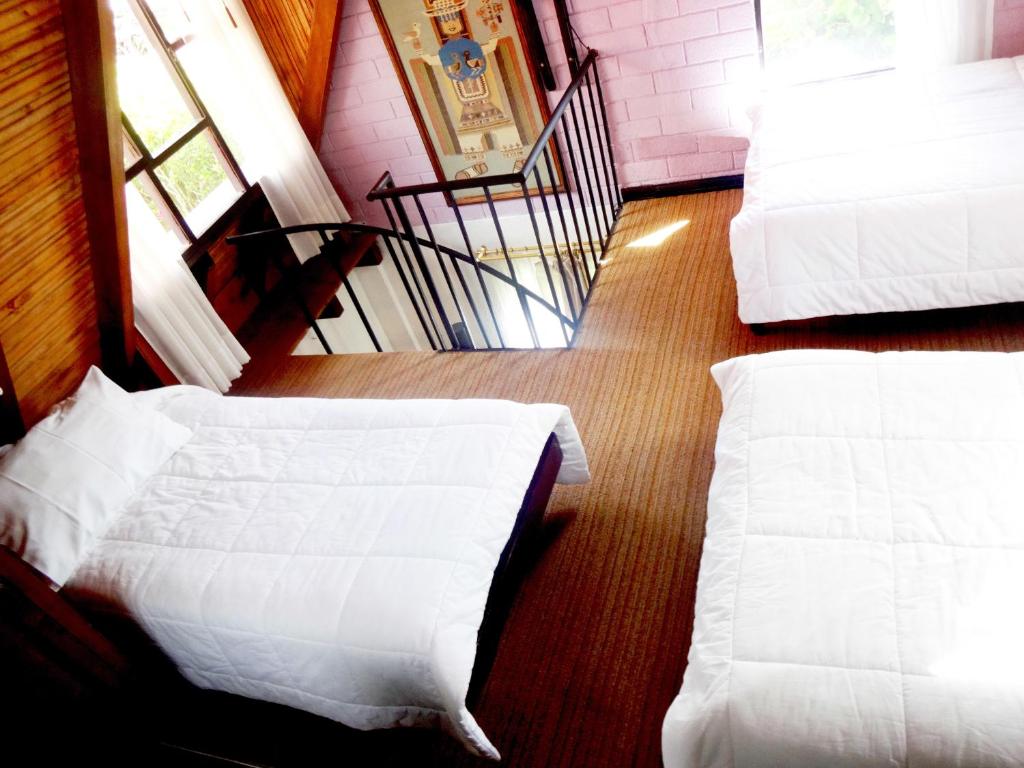 Postel nebo postele na pokoji v ubytování Hosteria Casa Giralda