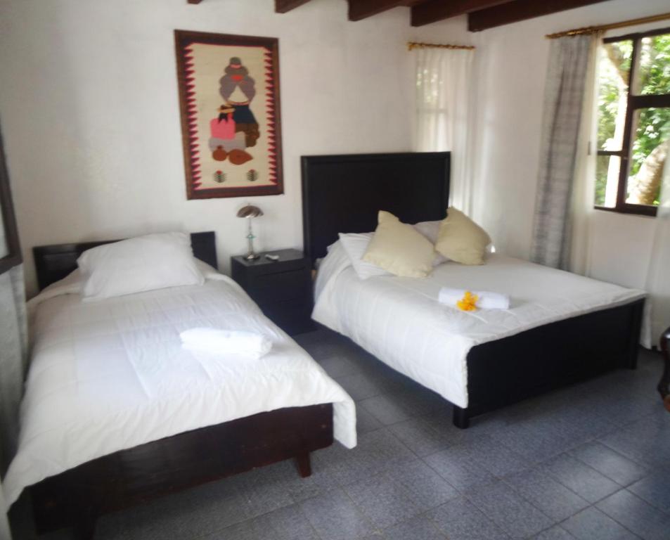 Postel nebo postele na pokoji v ubytování Hosteria Casa Giralda