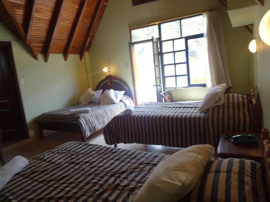 Postel nebo postele na pokoji v ubytování Hosteria Casa Giralda
