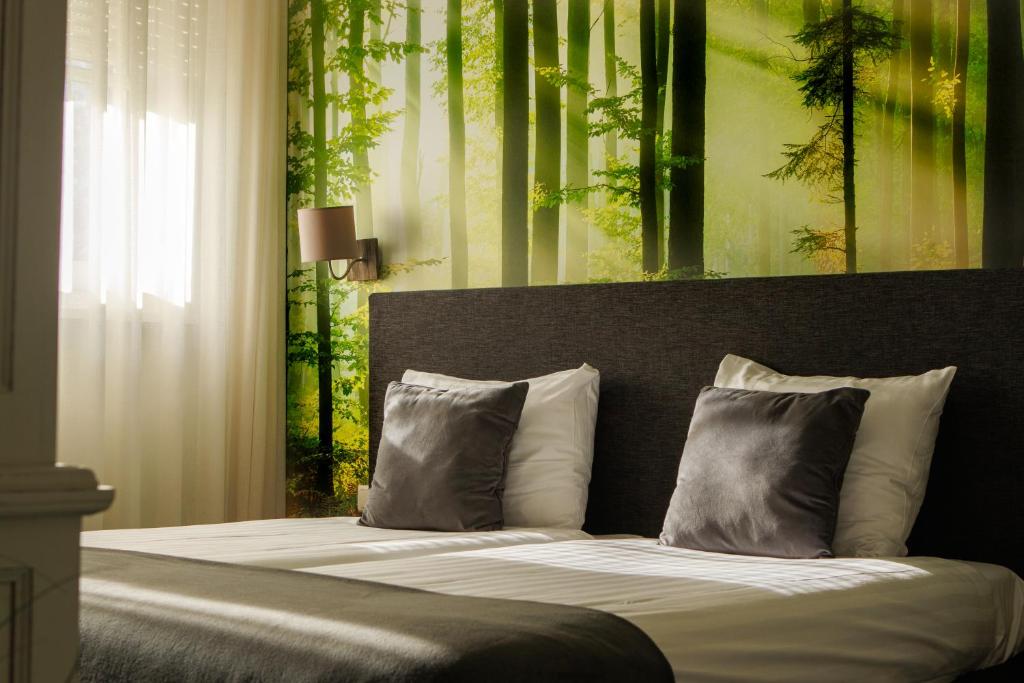 Postel nebo postele na pokoji v ubytování Landhuis Hotel de Hilkensberg