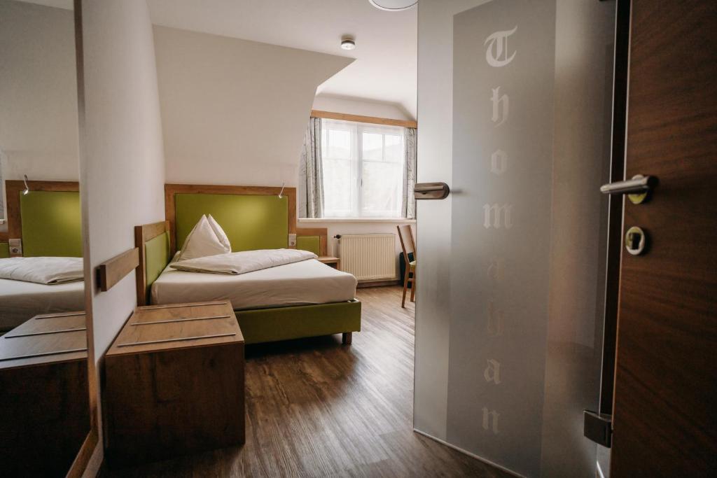 Postel nebo postele na pokoji v ubytování Gästehaus Thomahan