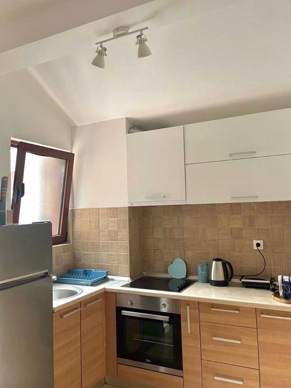Kuchyň nebo kuchyňský kout v ubytování Apartment R