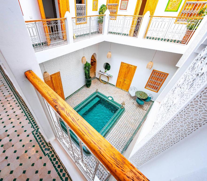an overhead view of a swimming pool in a house at Riad La Croix Berbere in Marrakesh