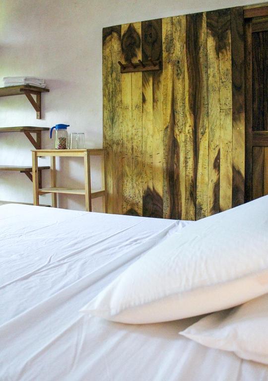 Rúm í herbergi á Posada La Sabila