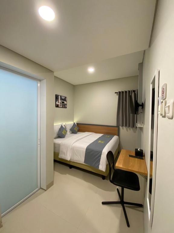 Ghurfati Hotel Wedana tesisinde bir odada yatak veya yataklar