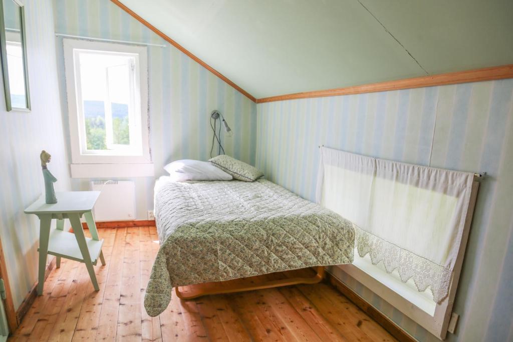 Postel nebo postele na pokoji v ubytování Lakeside Guesthouse, Lillstugan