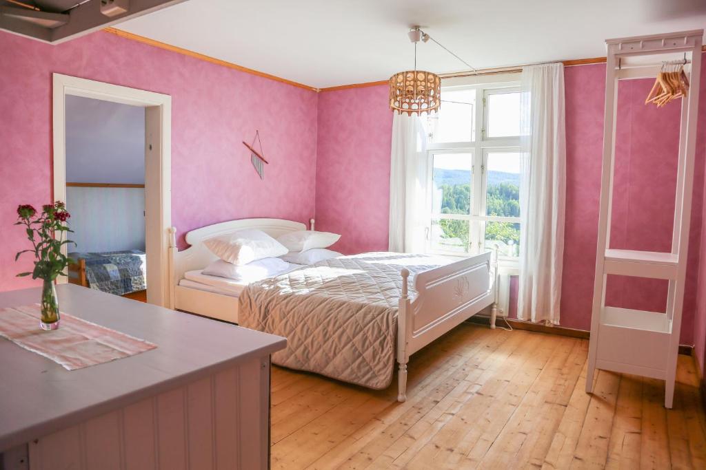 Postel nebo postele na pokoji v ubytování Lakeside Guesthouse, Lillstugan