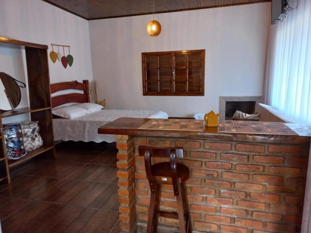 Postel nebo postele na pokoji v ubytování Chalé Mirante Da Guapiara