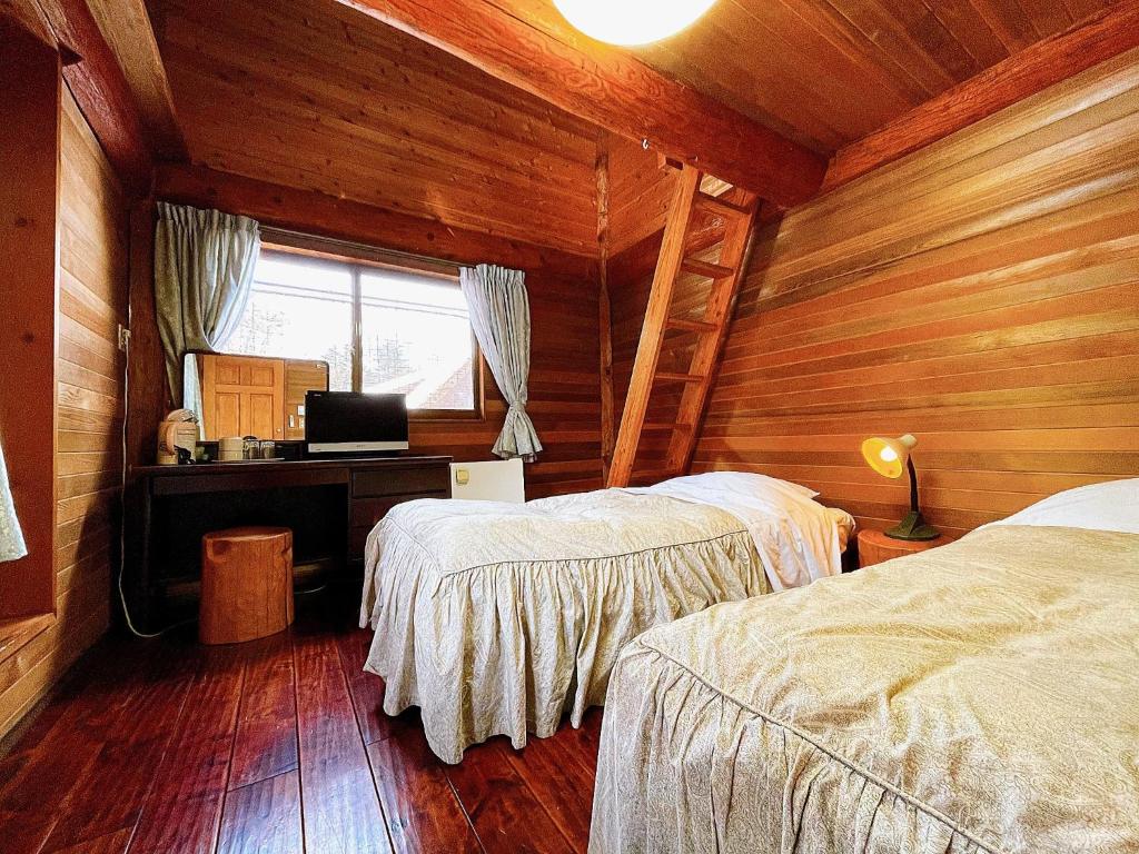 Tempat tidur dalam kamar di Hakuba Pension Meteor - Vacation STAY 23067v