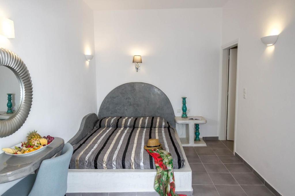 Postel nebo postele na pokoji v ubytování Remvi Suites