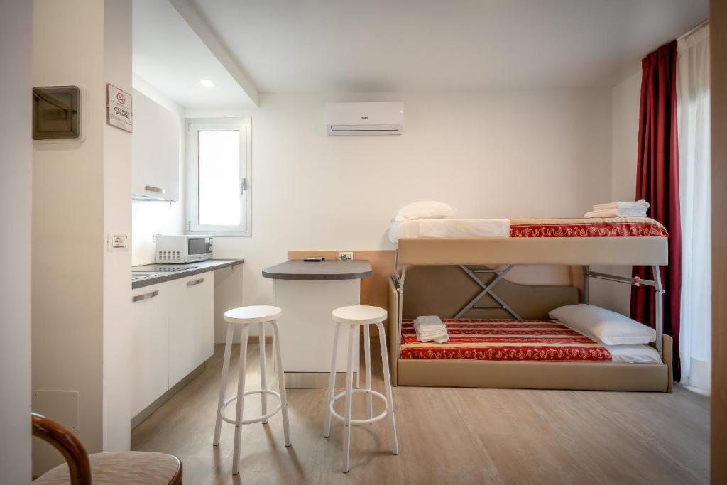 Postel nebo postele na pokoji v ubytování Hotel Palladio