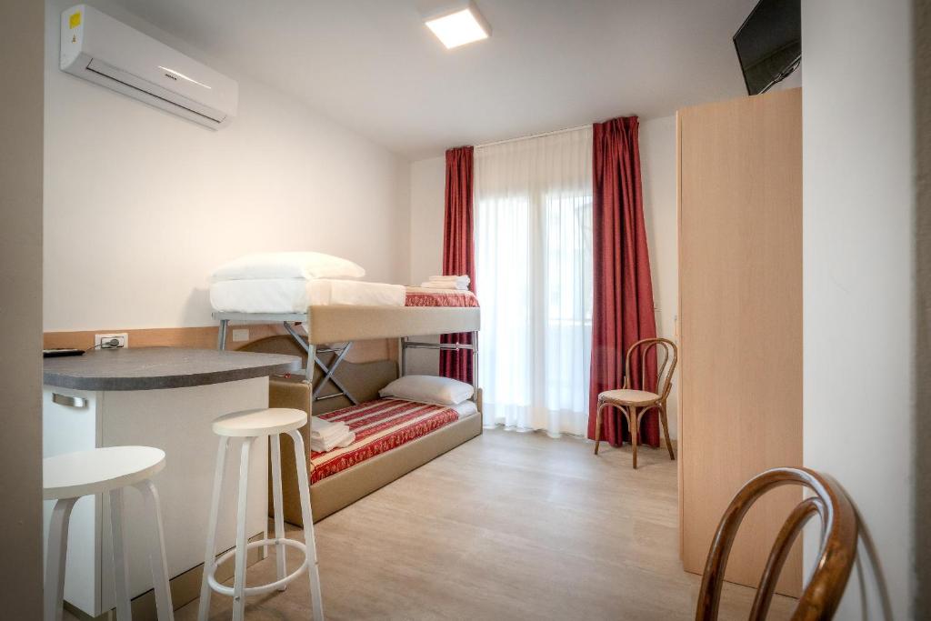 Postel nebo postele na pokoji v ubytování Hotel Palladio
