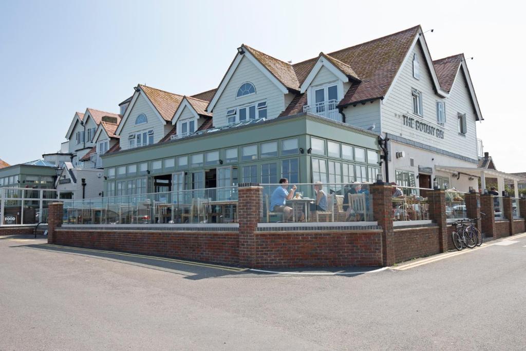a large building with people sitting inside of it at Botany Bay Hotel in Broadstairs