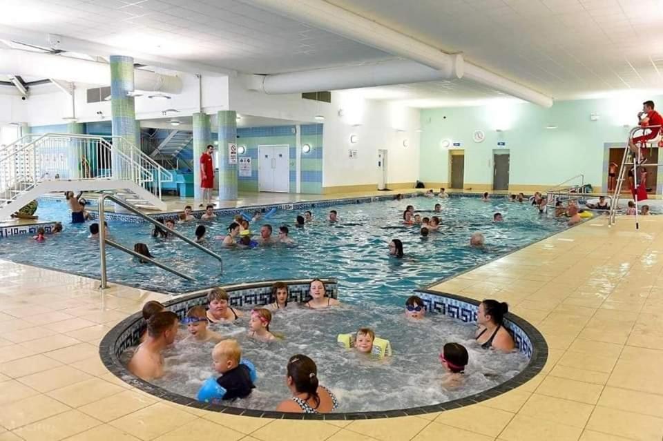 a large group of people in a swimming pool at Making Memories Holiday Caravan in Skegness