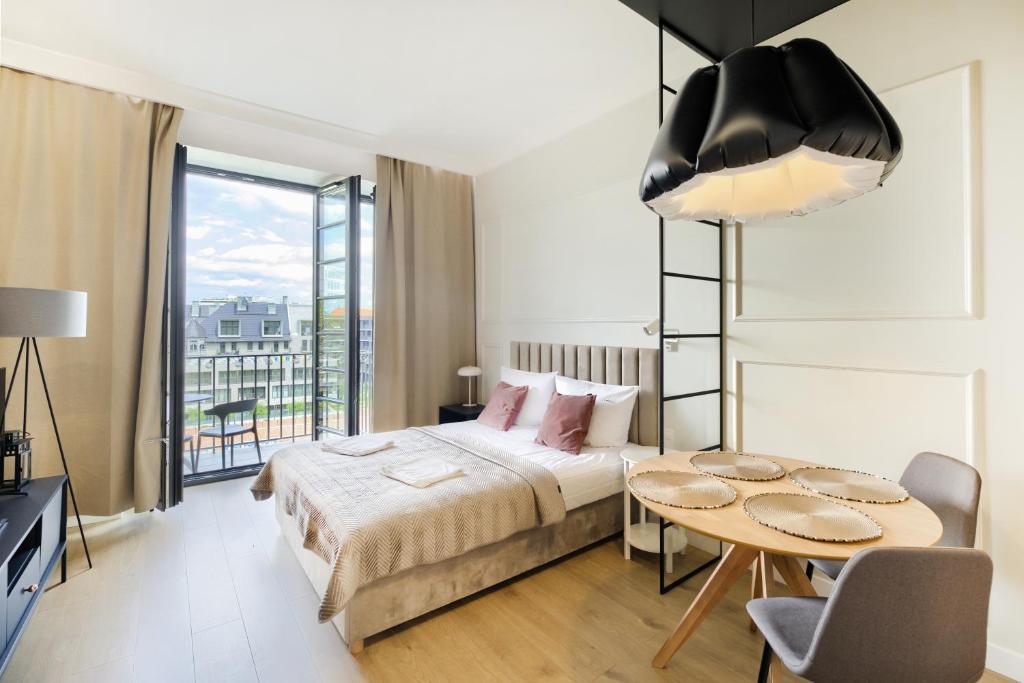 Posteľ alebo postele v izbe v ubytovaní AboutArtApartments - By the river