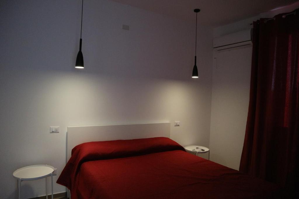 Postel nebo postele na pokoji v ubytování L'Atelier di Vittoria