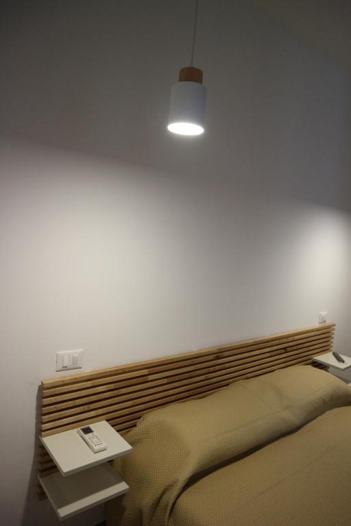 Postel nebo postele na pokoji v ubytování L'Atelier di Vittoria