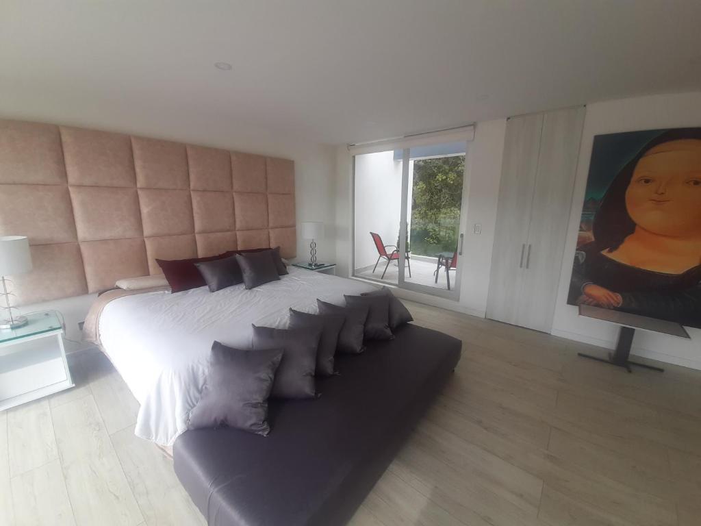 Postel nebo postele na pokoji v ubytování Mirador samsara Suite Luxury piso completo