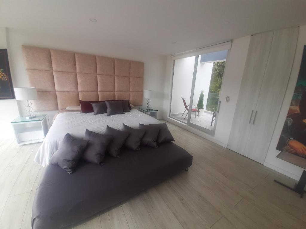 Postel nebo postele na pokoji v ubytování Mirador samsara Suite Luxury piso completo
