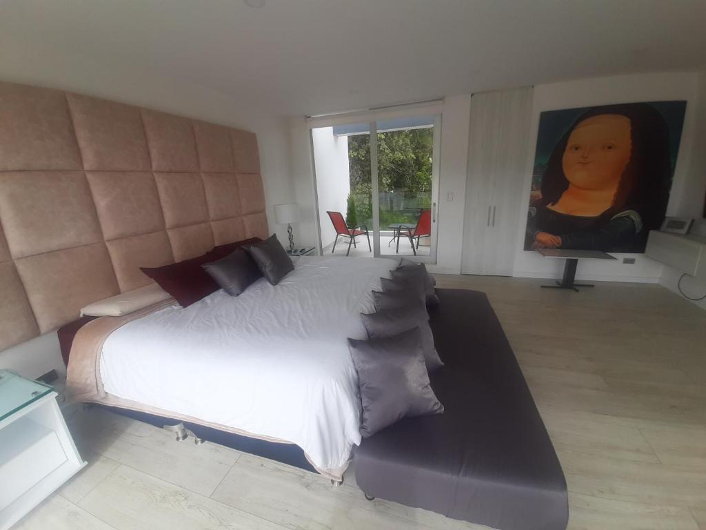 Postel nebo postele na pokoji v ubytování Mirador samsara Suite Luxury piso completo