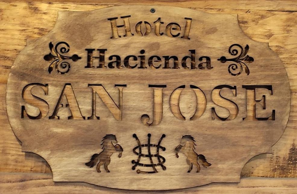 a sign that says hotel hacienda san jose at Hotel Hacienda San José in San Francisco del Rincón