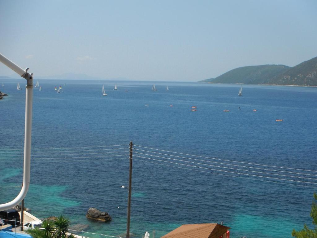 a view of a large body of water with boats at Dimitris Apartments in Vasiliki