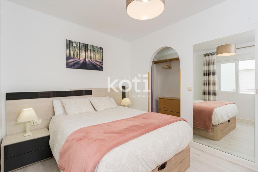 A bed or beds in a room at Koti Rentals - Gamycol 2