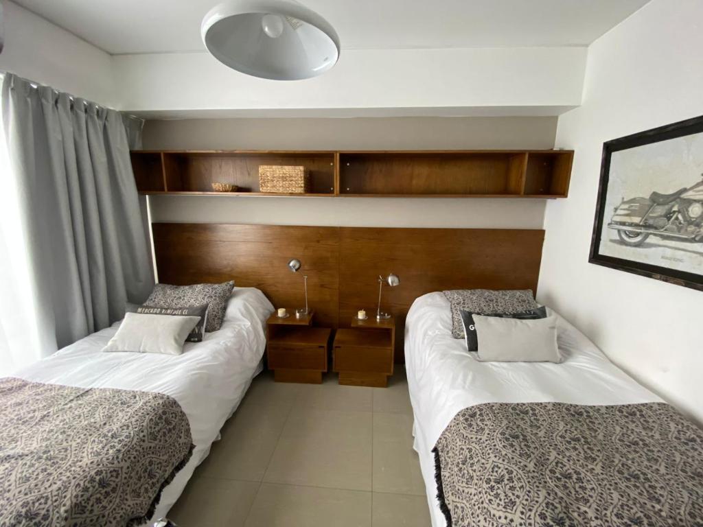 Una cama o camas en una habitación de Tu Apart en Buenos Aires 11