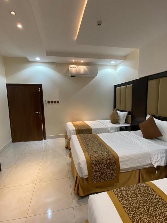 Postel nebo postele na pokoji v ubytování Alwan apartment hotel