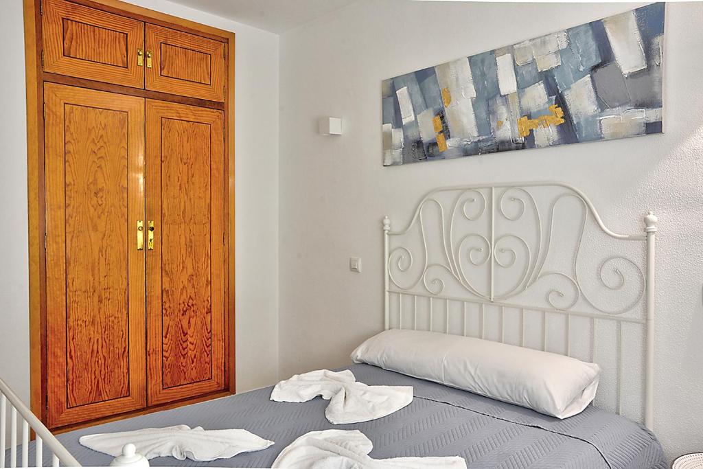 Łóżko lub łóżka w pokoju w obiekcie Apartamento Exclusivo en Sevilla