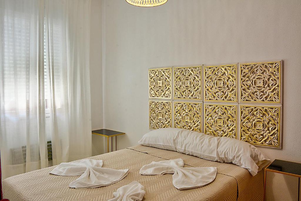 Łóżko lub łóżka w pokoju w obiekcie Apartamento Exclusivo en Sevilla