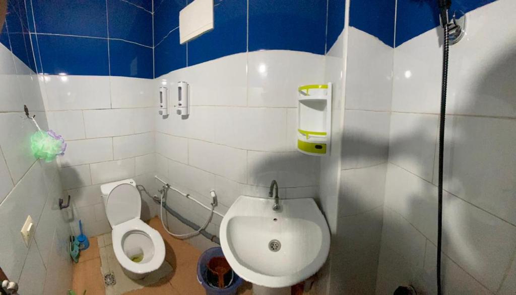 a bathroom with a toilet and a sink at Modern Moroccan apartment near the beach in Safi in Safi