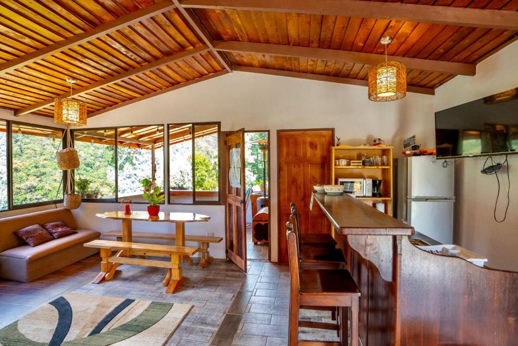 a kitchen with a counter and a table in a room at Casa#7 in San José