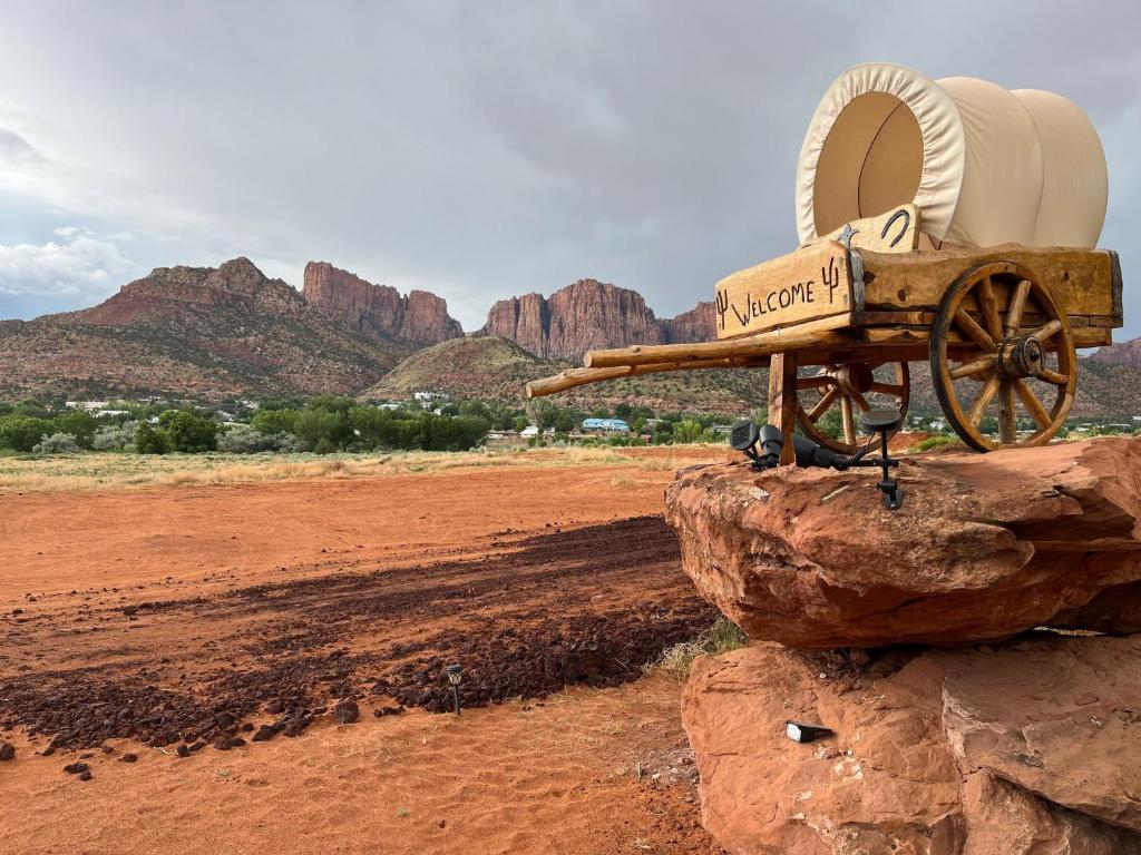 a cannon sitting on top of a rock in the desert at Zion View Camping in Hildale