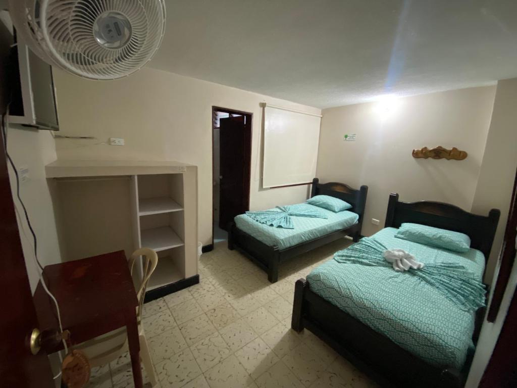 Säng eller sängar i ett rum på Hotel calima