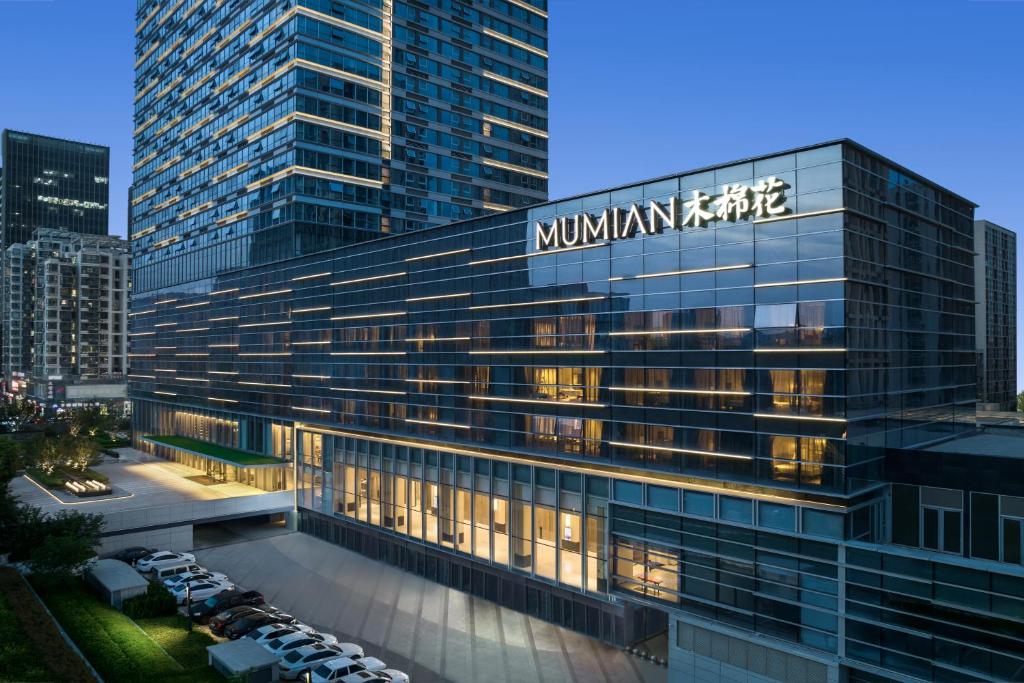 a large building with a mountain ridge sign on it at RiZhao Mumian Hotel in Rizhao